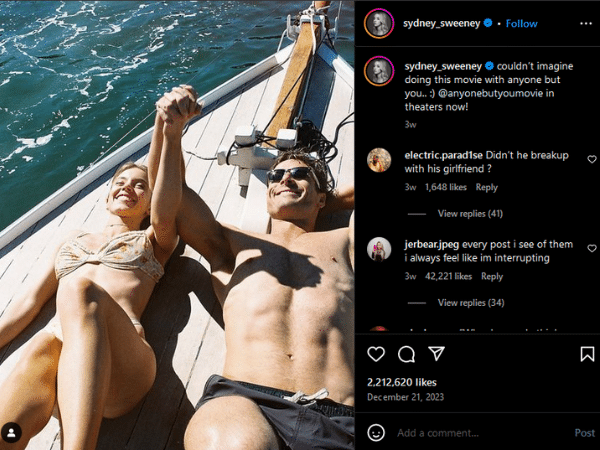 A man and woman in bikinis on a boat.