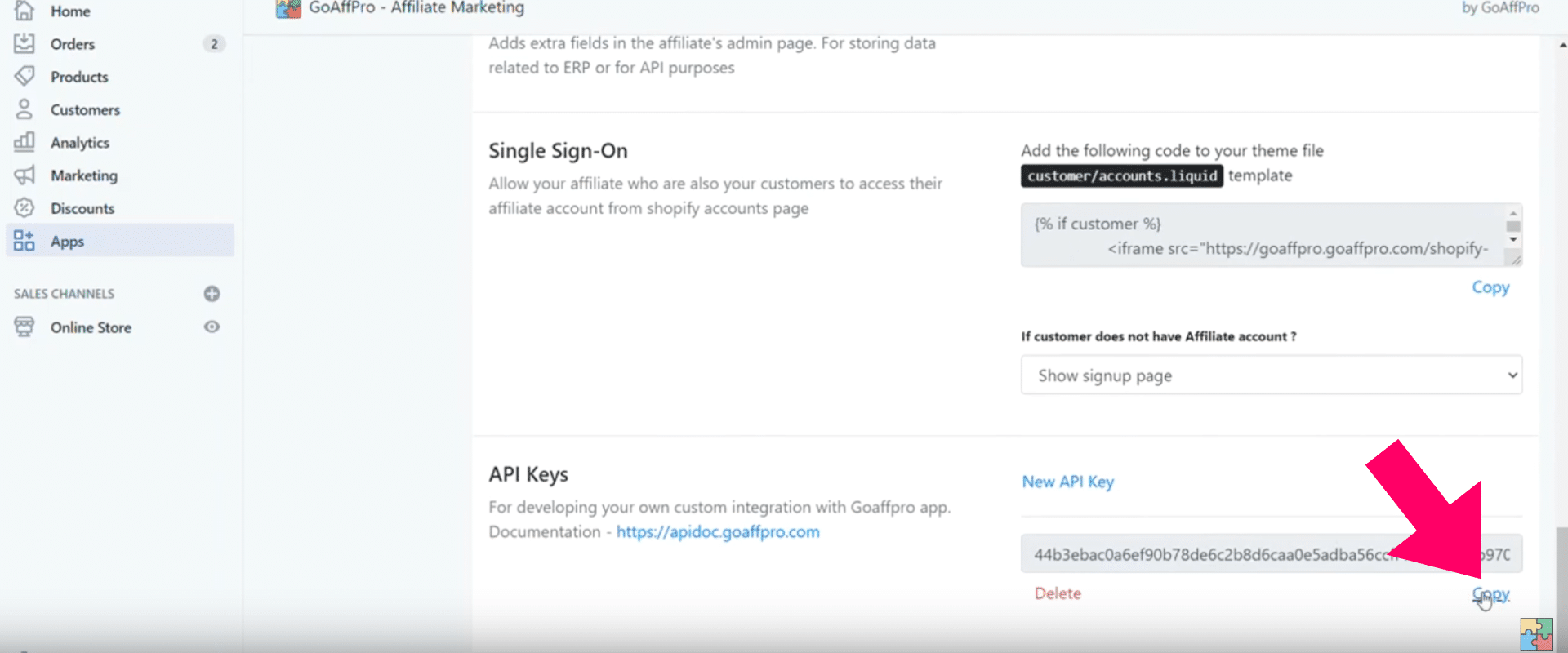 Screenshot of a Shopify web page showing settings for a "GoAffPro - Affiliate Marketing" app. The "API Keys" section is visible with a new key partially hidden. A large red arrow points to the "Copy" link.