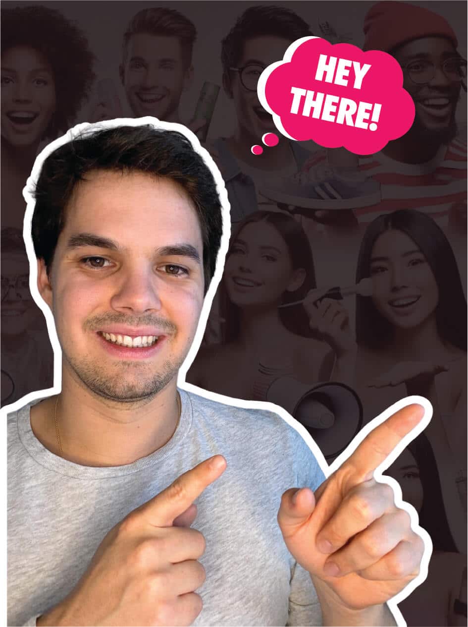 A man wearing a gray shirt points both index fingers while smiling. A pink speech bubble above him says, "HEY THERE!" A collage of various smiling faces is in the background.
